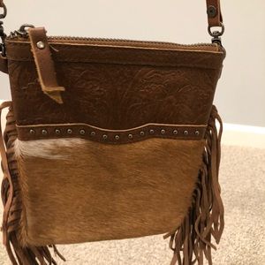 Cowhide fringed purse